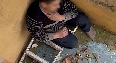 Çatıya saklanan firari, polisi izlerken yakalandı